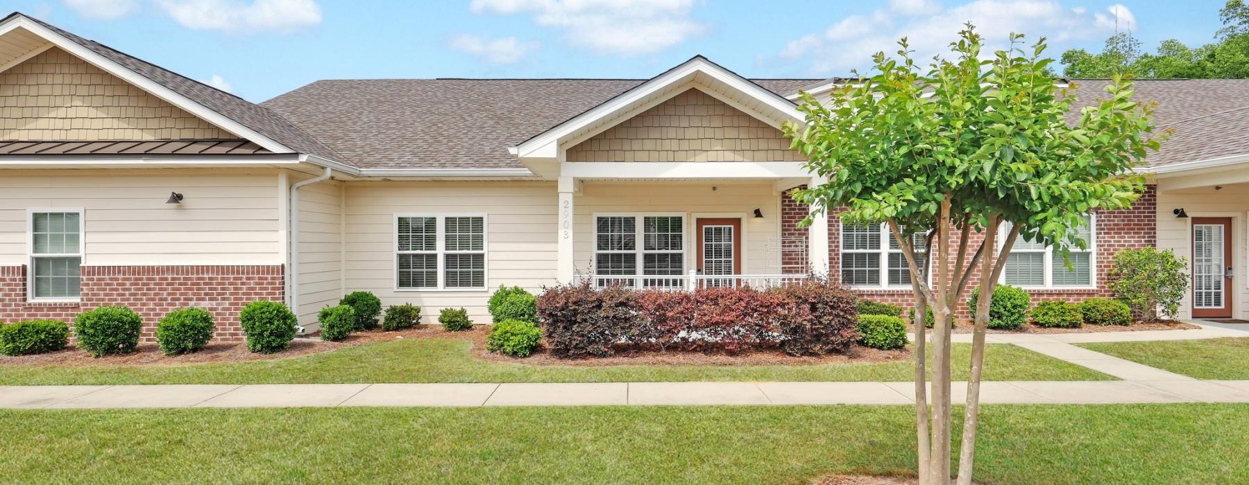 a house with a tree in the front yard